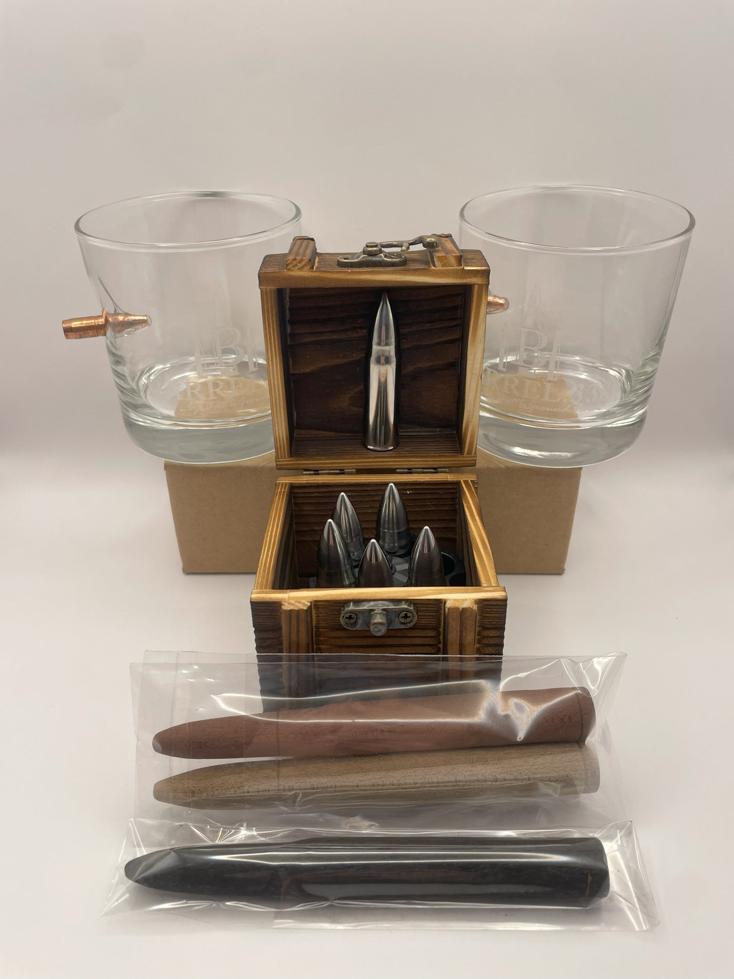 Bourbon chilling and aging gift set with bullet-shaped stones, glasses, and flavor infusion staves